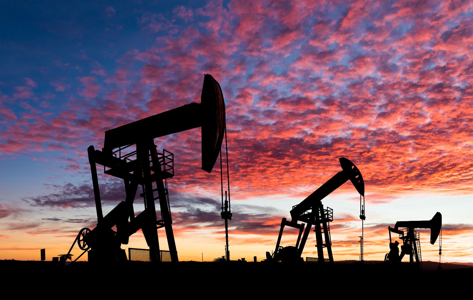 Oil pumpjacks at sunset on the Texas plains